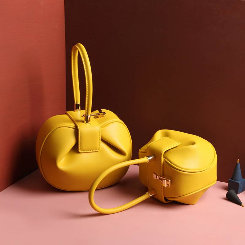 yellow top handle bag