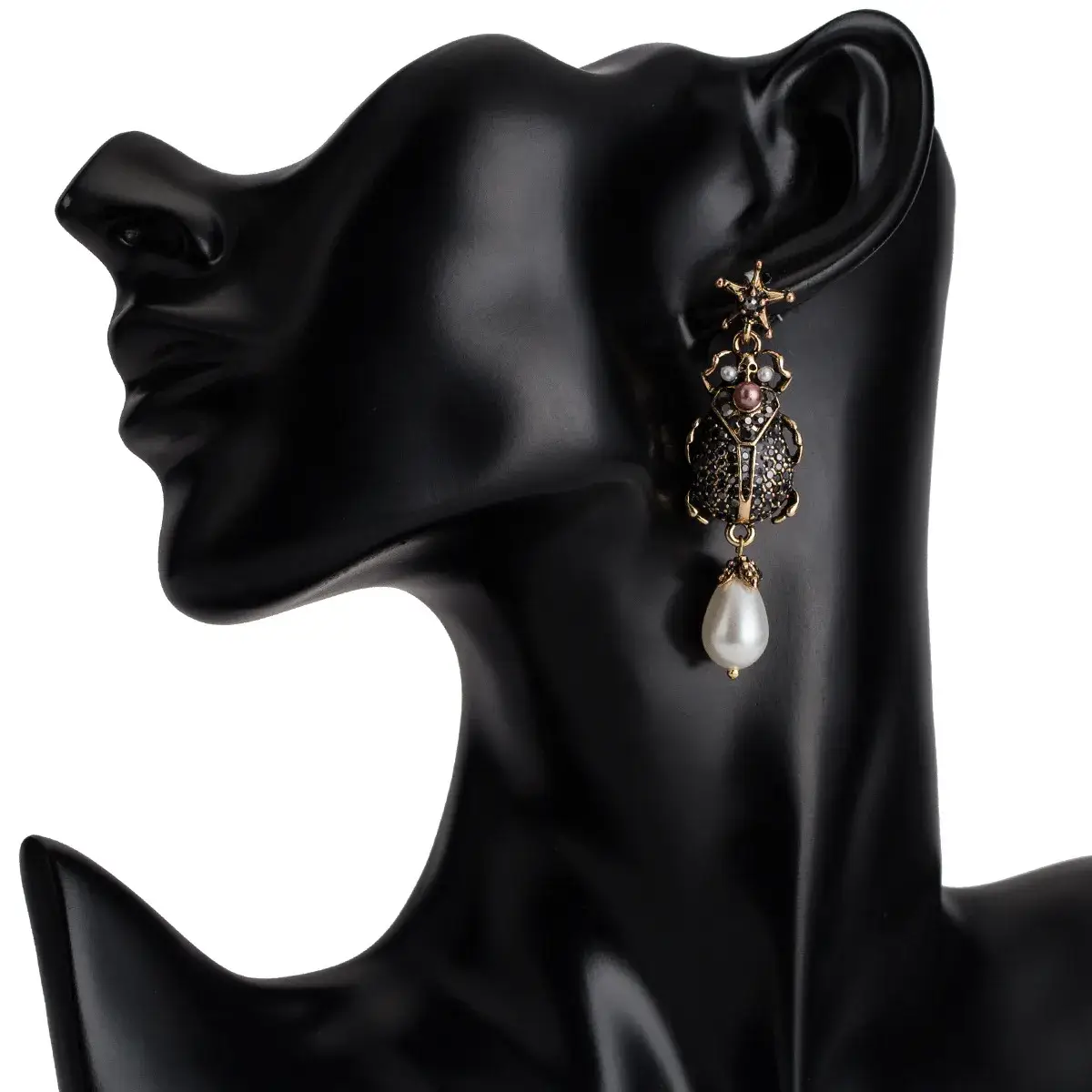 black scarab earrings display