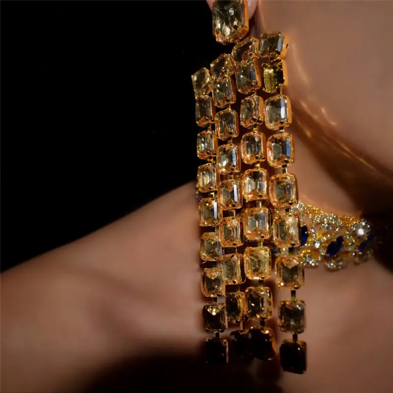 model wearing gold fringe earrings