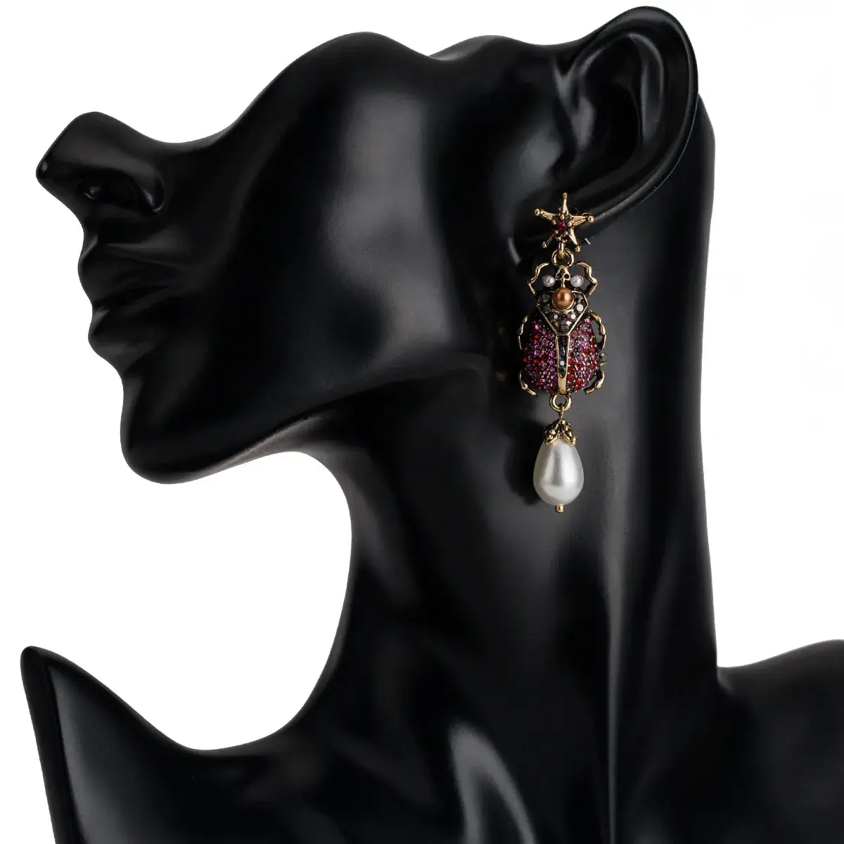 red scarab earrings display