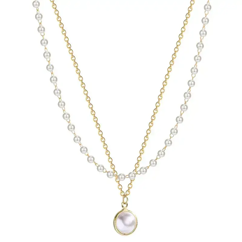 gold and pearl layered necklaces