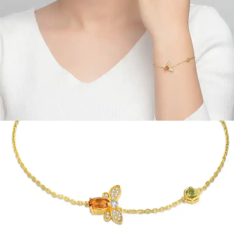 gold peridot bracelet model display