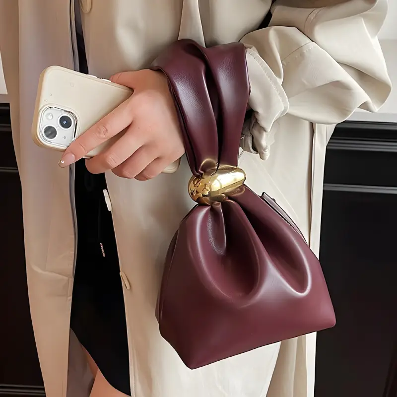 burgundy handbag model display