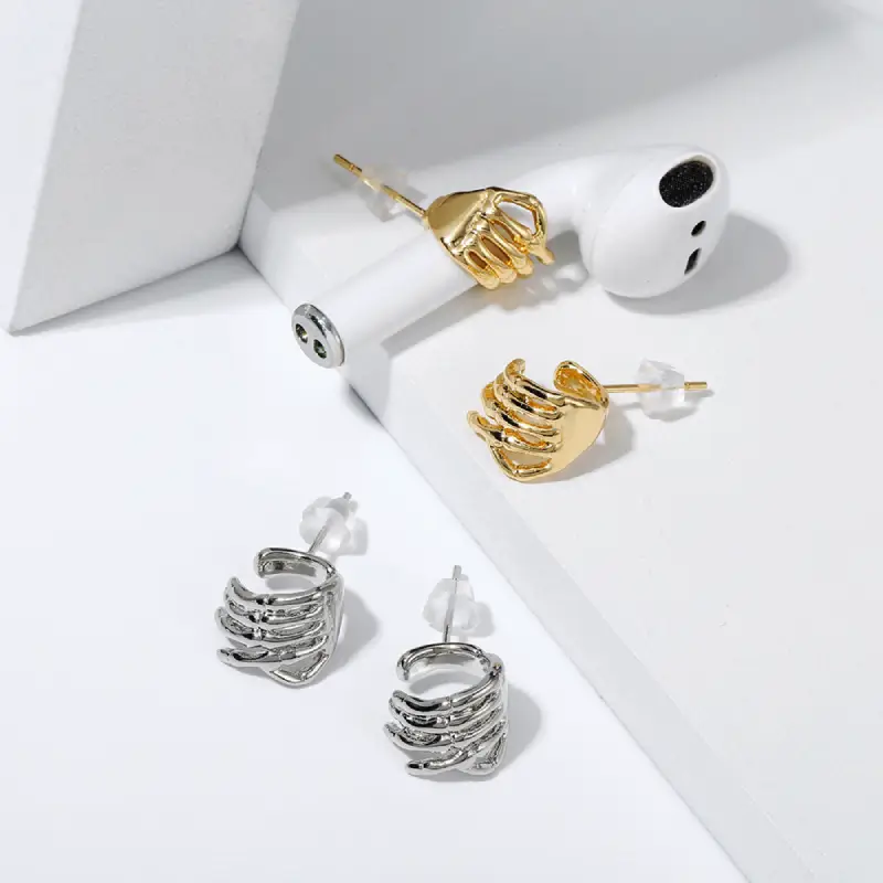 silver and gold audio earrings display