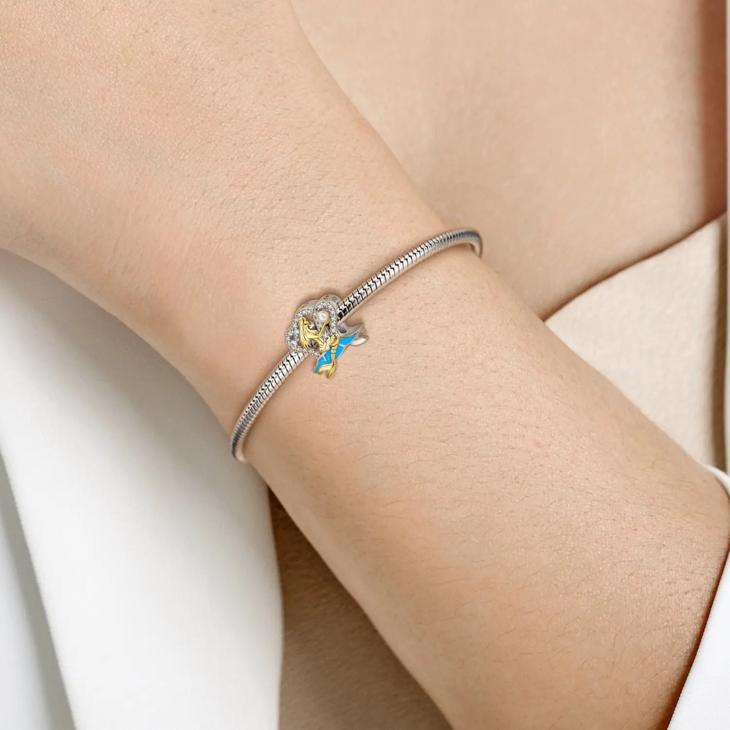 model with silver mermaid charm